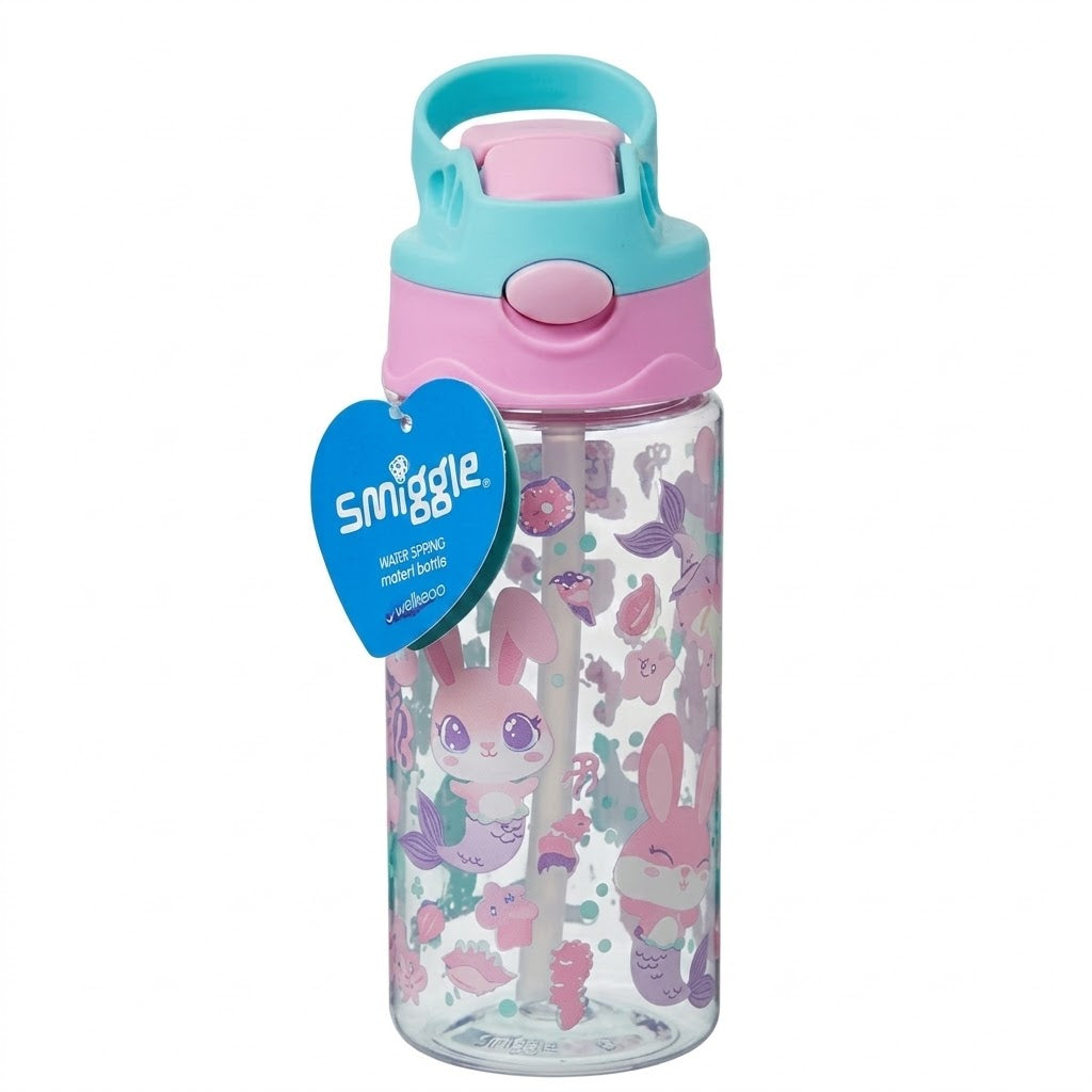 A Smiggle brand water bottle with a pink and teal lid, featuring a clear body decorated with pink mermaids and bunnies, and a blue heart-shaped hang tag.