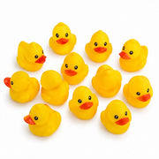 Set of ten yellow duck bath toys with orange beaks
