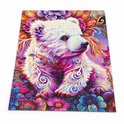 Assembled jigsaw puzzle featuring a white bear with ornate swirling details, surrounded by vibrant flowers.