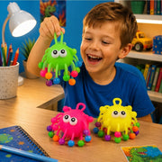 Child holding colorful stretchy bead ball sensory toy